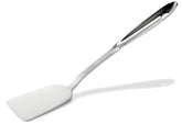 All-Clad spatule face montrant la largueur et précision pour retourner aliments