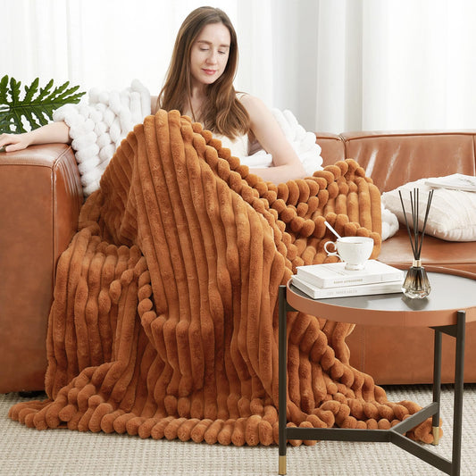 Amélie Home vue avant du plaid orange brun apportant chaleur décorative