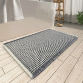 AMOAMI vue avant du tapis montrant le motif gaufre et finition, maintien du sol sec