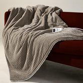 blunique vue avant du plaid chauffant montrant design khaki et bordure, confort immédiat