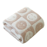 Brnabiou plaid face avant motif damier et sourire, apporte confort visuel