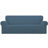 Easy-Going vue frontale de la housse Bluestone protégeant le canapé, look soigné