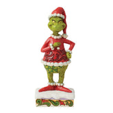 Enesco Jim Shore Grinch face avant montrant sourire festif et motifs patchwork pour décoration