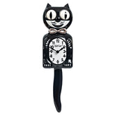 Kit Cat Klock face avant noire élégante montrant contraste ivoire et design distinctif