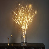 LITBLOOM branches en vase montrant ambiance chaleureuse