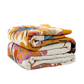 LUTBM plaid sur lit montrant confort et style bohème
