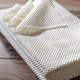 nuLOOM packaging frontal montrant sous-tapis, protection immédiate