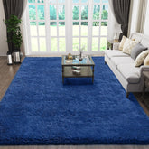 Ophanie tapis devant canapé bleu navy apportant confort au salon