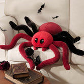 Phantoscope coussin araignée face montrant design rouge et bordeaux, attire l'œil