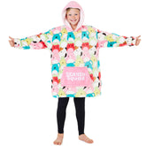 Squishmallows devant packaging montrant coupe oversize et style