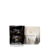 Bougie Thymes Noir Woods face avant, design noir et doré élégant