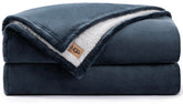 UGG couverture Nita face avant pliée, aspect luxueux et chaleur visible