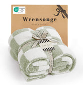 WRENSONGE plaid sur canapé apportant chaleur et style
