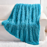 YUSOKI plaid face avant teal montrant luxe et confort