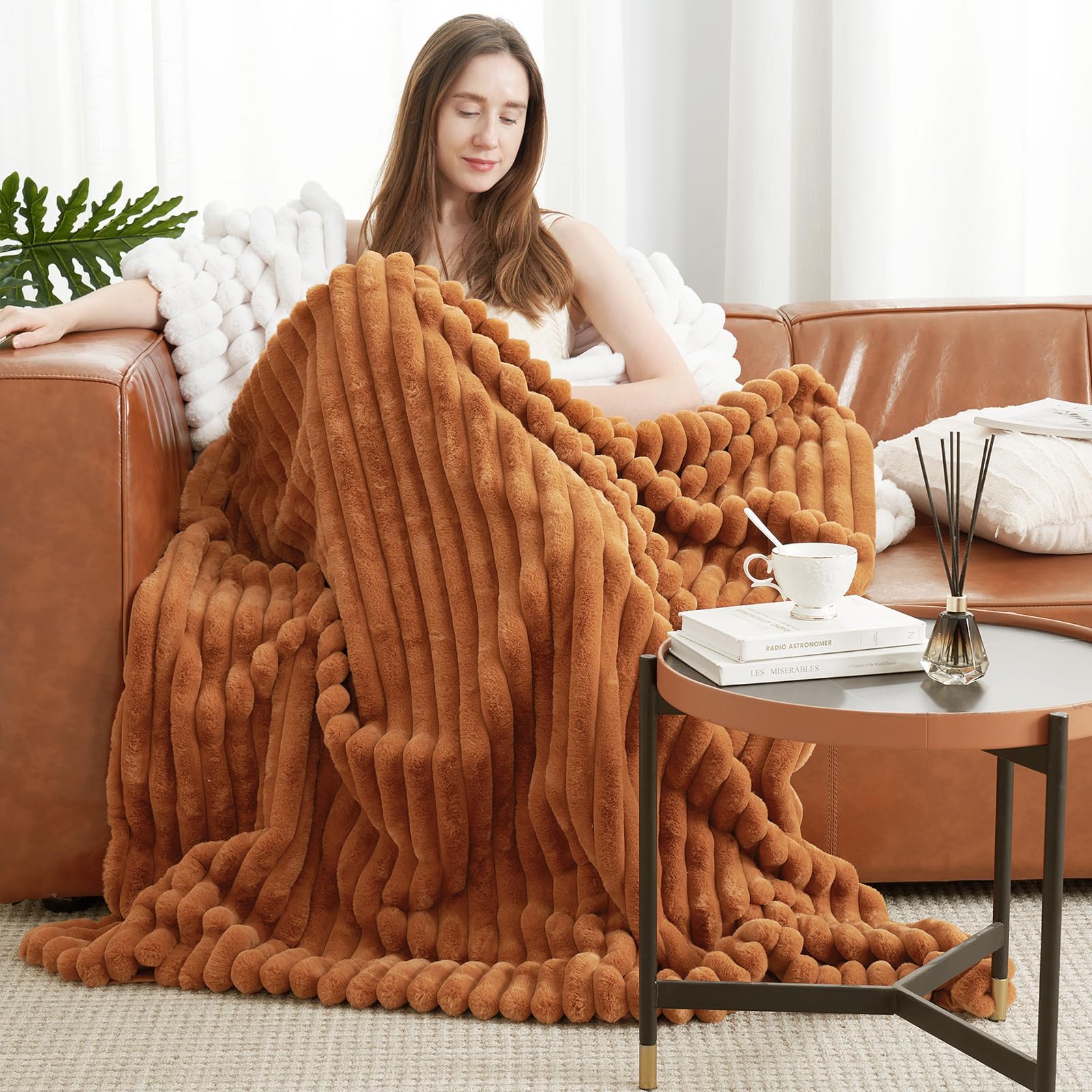 Amélie Home vue avant du plaid orange brun apportant chaleur décorative