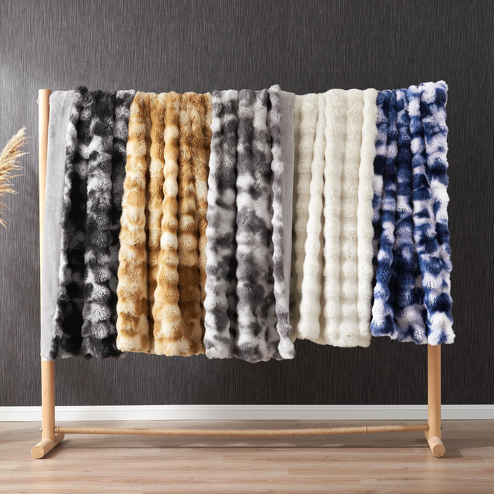 Amélie Home plaid utilisé sur lit apportant confort cosy immédiat