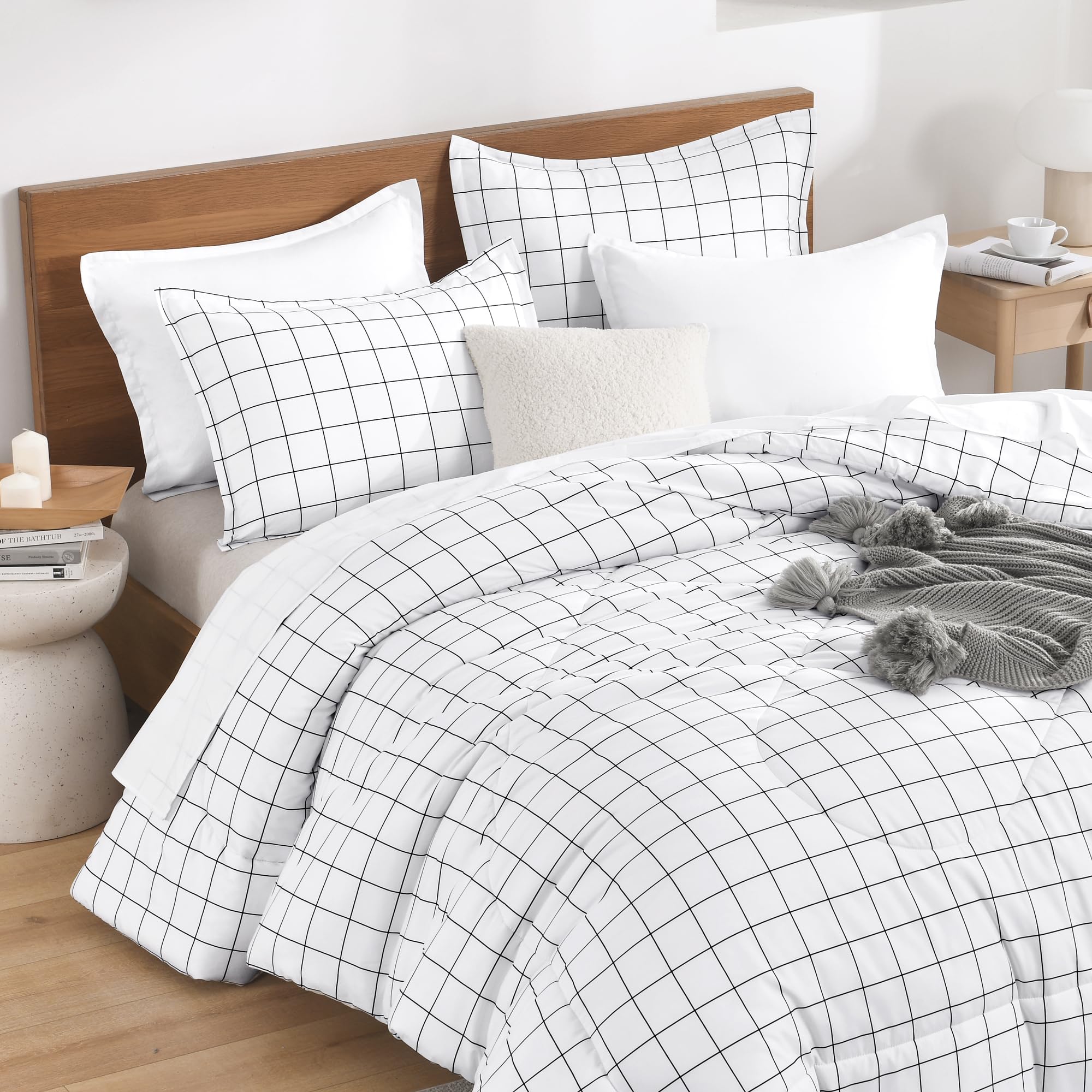 Andency couette sur lit complet illustrant tombée nette et confort visuel