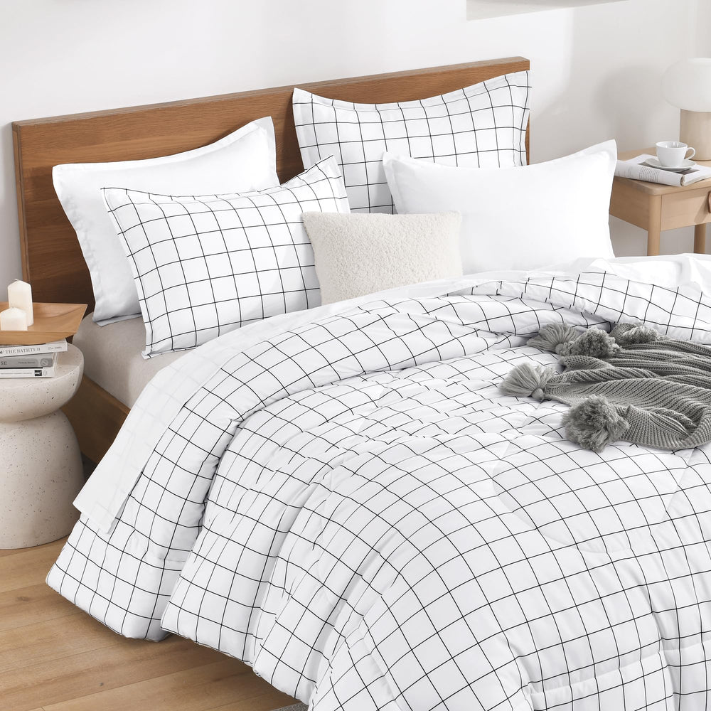 Andency couette sur lit complet illustrant tombée nette et confort visuel