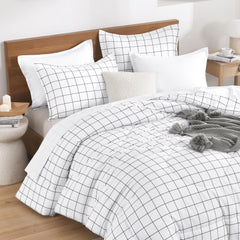 Andency couette sur lit complet illustrant tombée nette et confort visuel