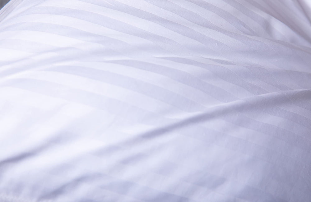 ArcticNorthDown détails surpiqûres et passepoil, évite fuite de duvet
