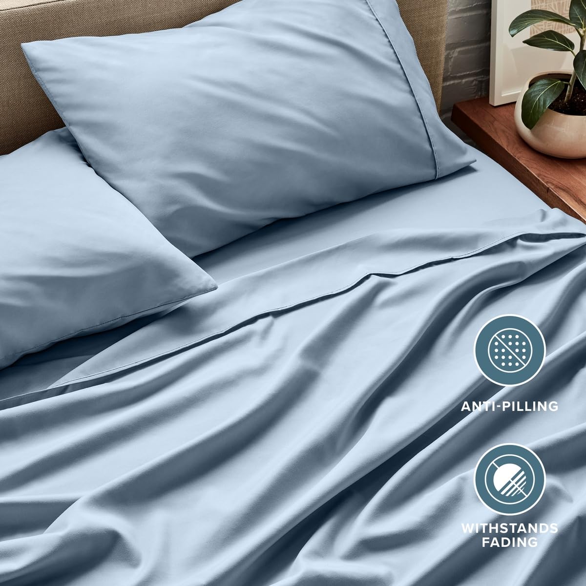 Bare Home draps en usage sur lit par un couple confort immédiat