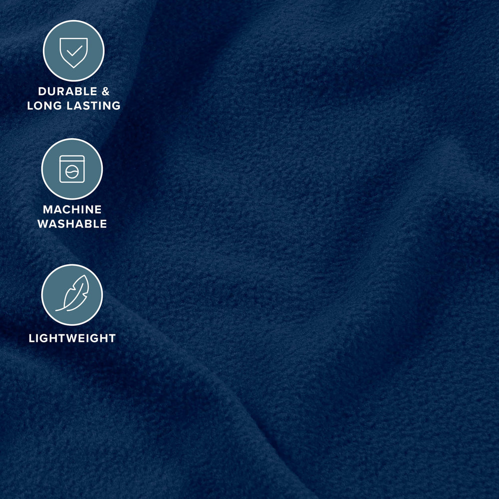 Bare Home draps posés sur lit bleu foncé illustrant chaleur et style