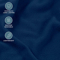 Bare Home draps posés sur lit bleu foncé illustrant chaleur et style
