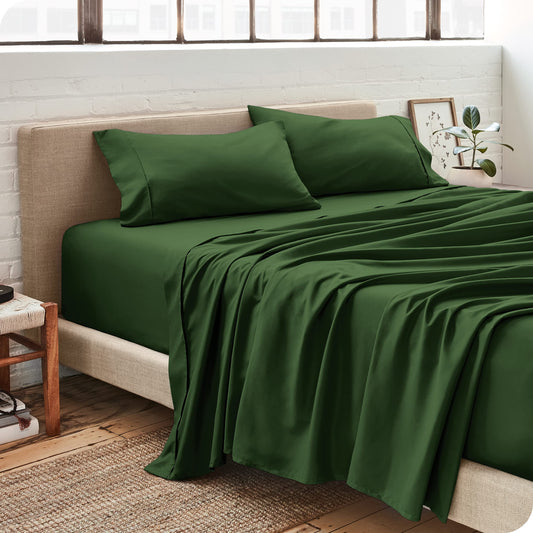 Bare Home pile de draps pliés démontrant rangement compact et polyvalence