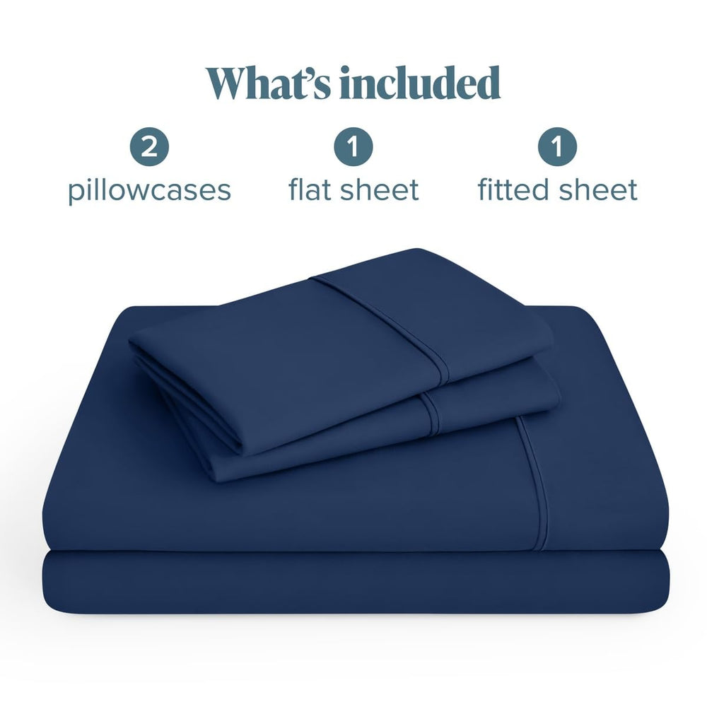 Bare Home draps pliés à côté d'une règle montrant dimension et échelle