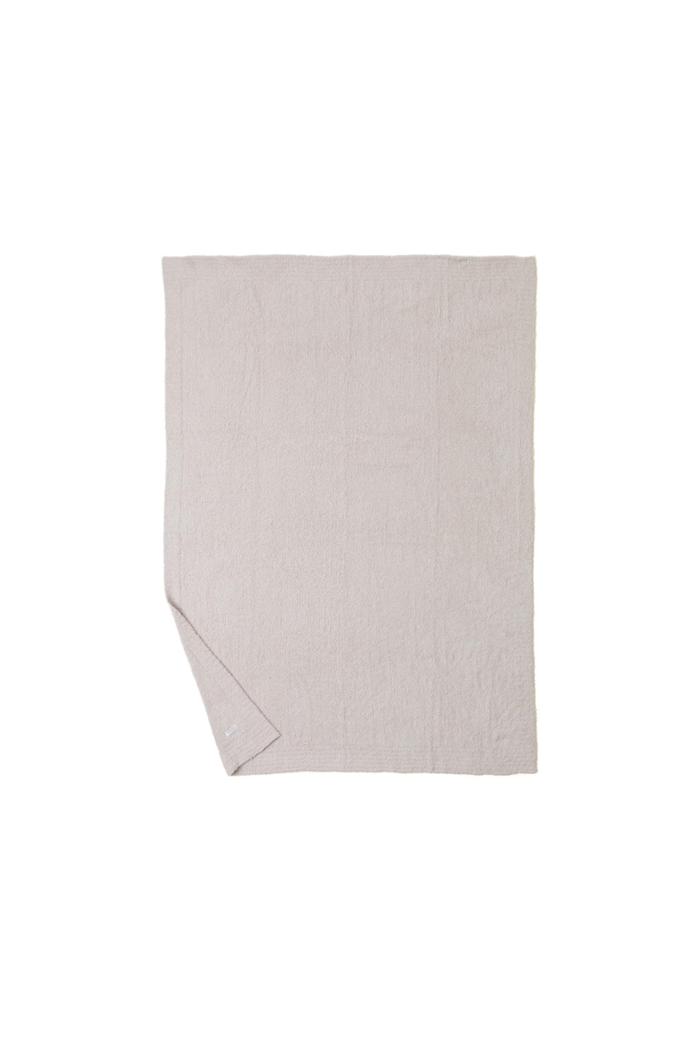 Barefoot Dreams couverture 54"x72" posée pour comparaison d'échelle pratique