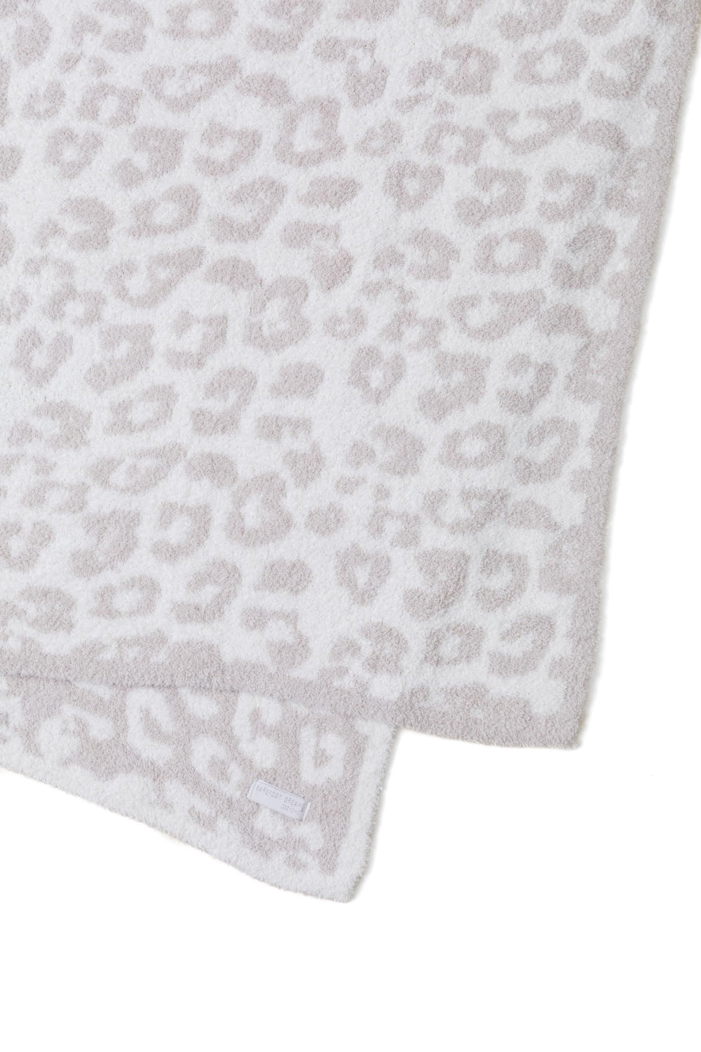 Barefoot Dreams détail jacquard motif animalier montrant finesse et tenue durable