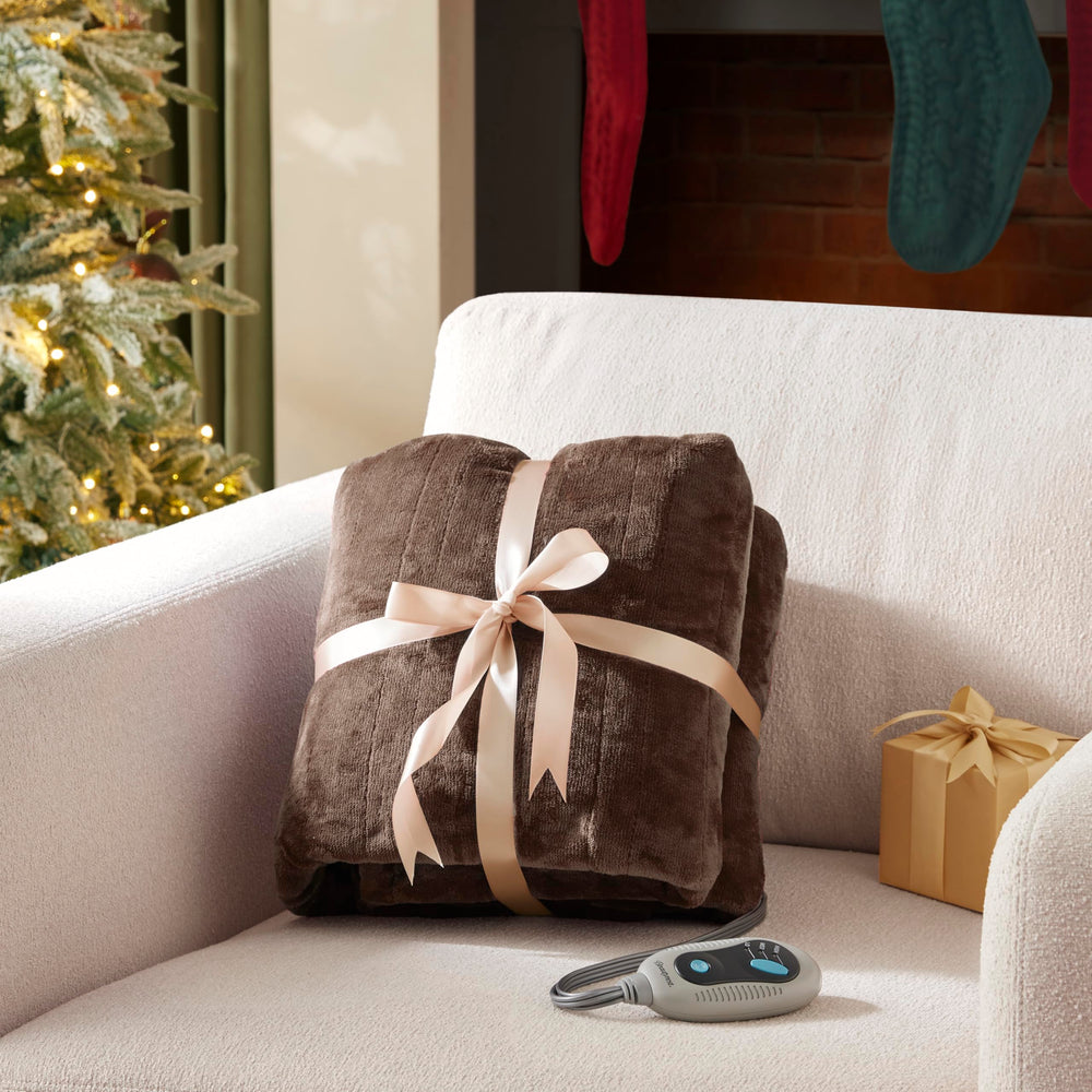 Beautyrest plaid sur canapé créant ambiance cosy et économie d'énergie