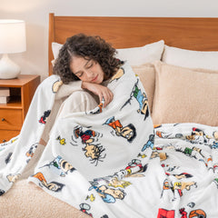 Berkshire Blanket enfant sur lit avec Snoopy, offre chaleur rassurante