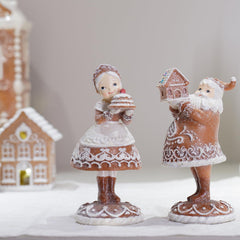 Braxio figurines sur manteau de cheminée créant ambiance chaleureuse