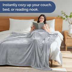 CGK Unlimited couverture étalée sur lit apportant style et chaleur instantanée