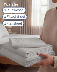 Drap-housse CGK Unlimited avec poches profondes illustrant l'ajustement sécurisé sur matelas jusqu'à 16 pouces