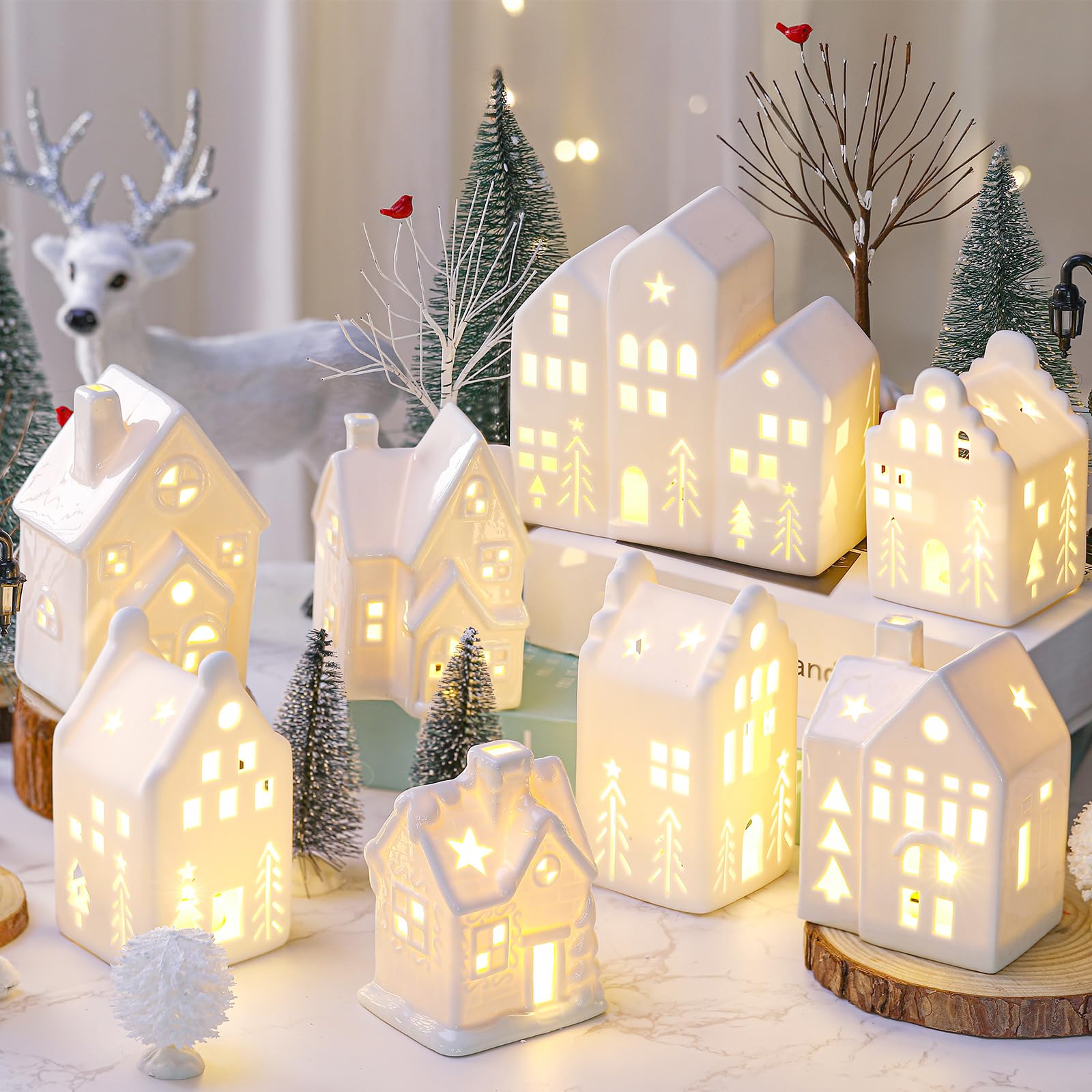 Cindeer village posé sur manteau de cheminée pour présentation festive