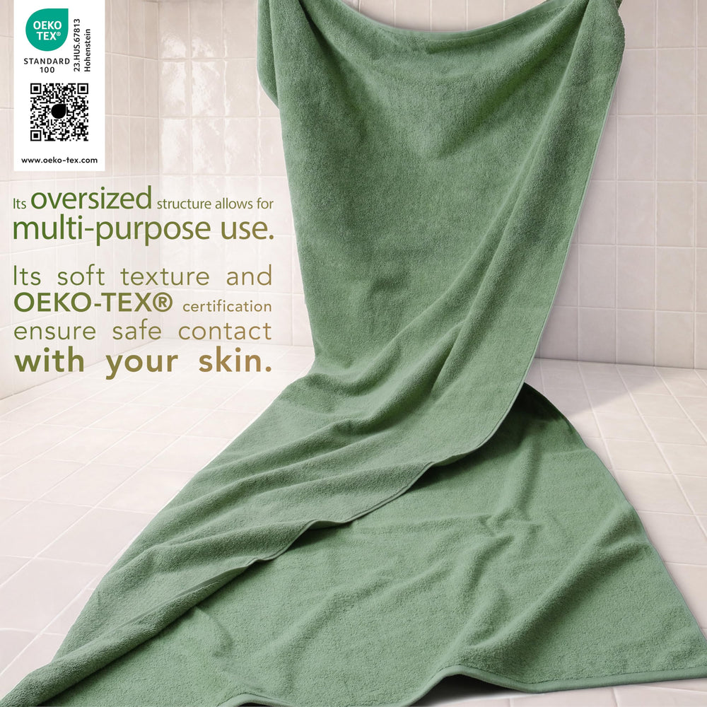 Serviette Cotton Paradise en usage enveloppant une personne après douche