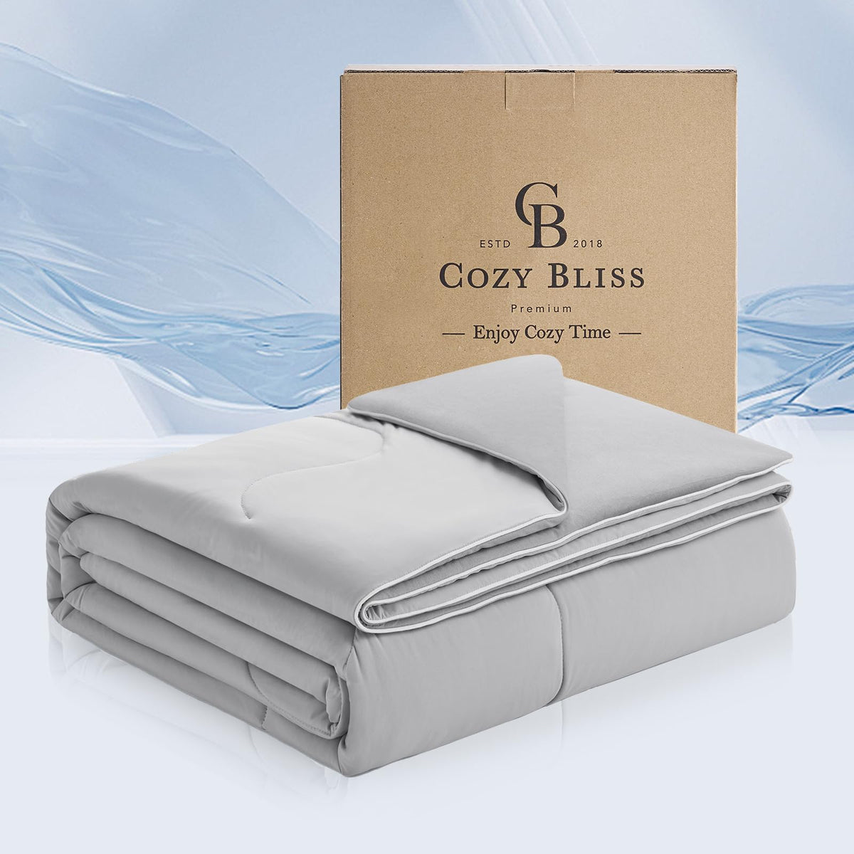 Cozy Bliss face avant présentant la couette gris clair et le design réversible pour un confort immédiat