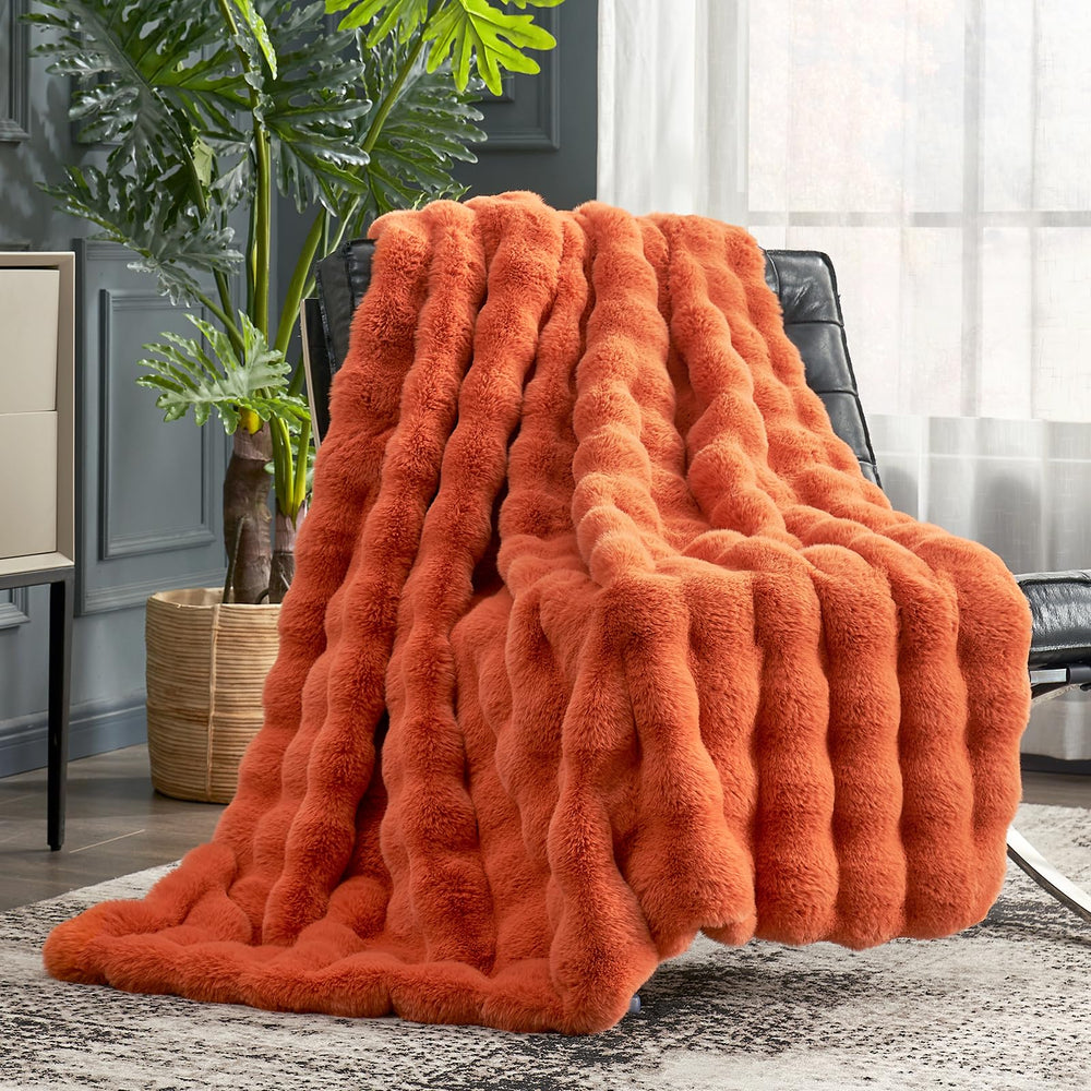 Cozy Bliss face du plaid montrant la couleur orange brûlé et douceur tactile
