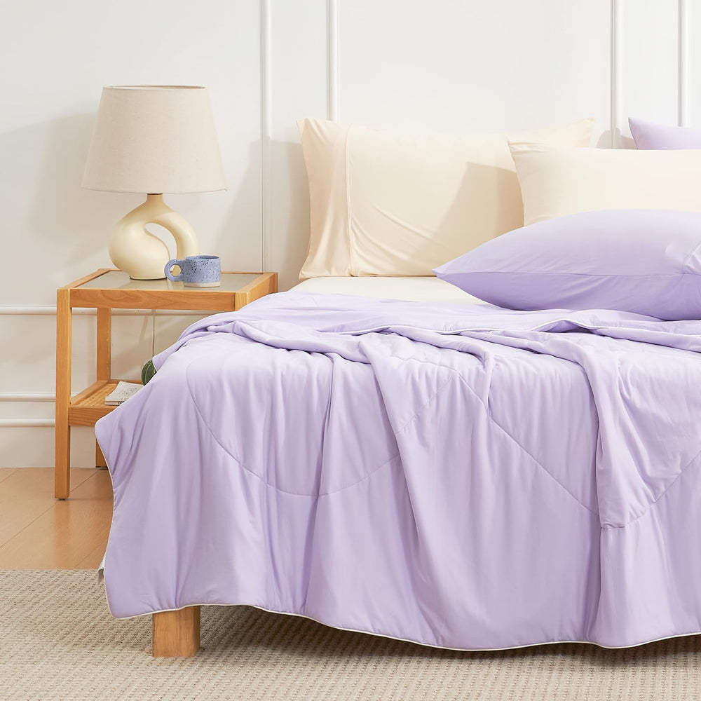 Cozy Bliss pliée dans valise démontrant portabilité pour voyages