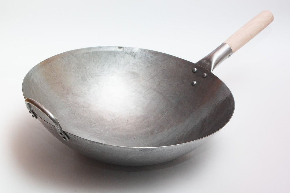 Craft Wok en usage saisissant des légumes pour cuisson homogène