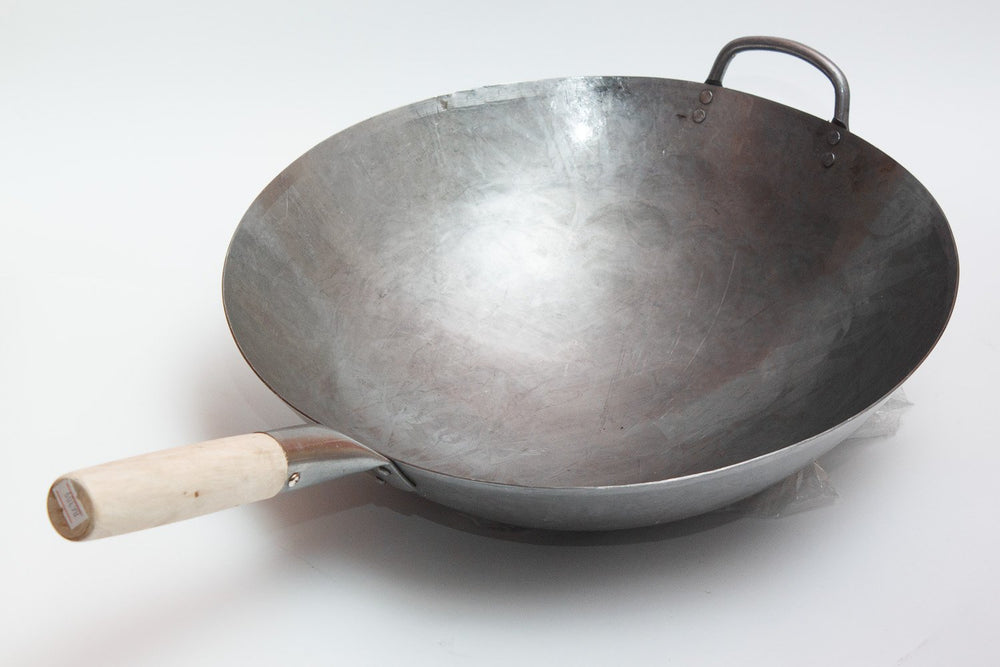 Craft Wok vue de profil montrant le fond rond et profondeur utile