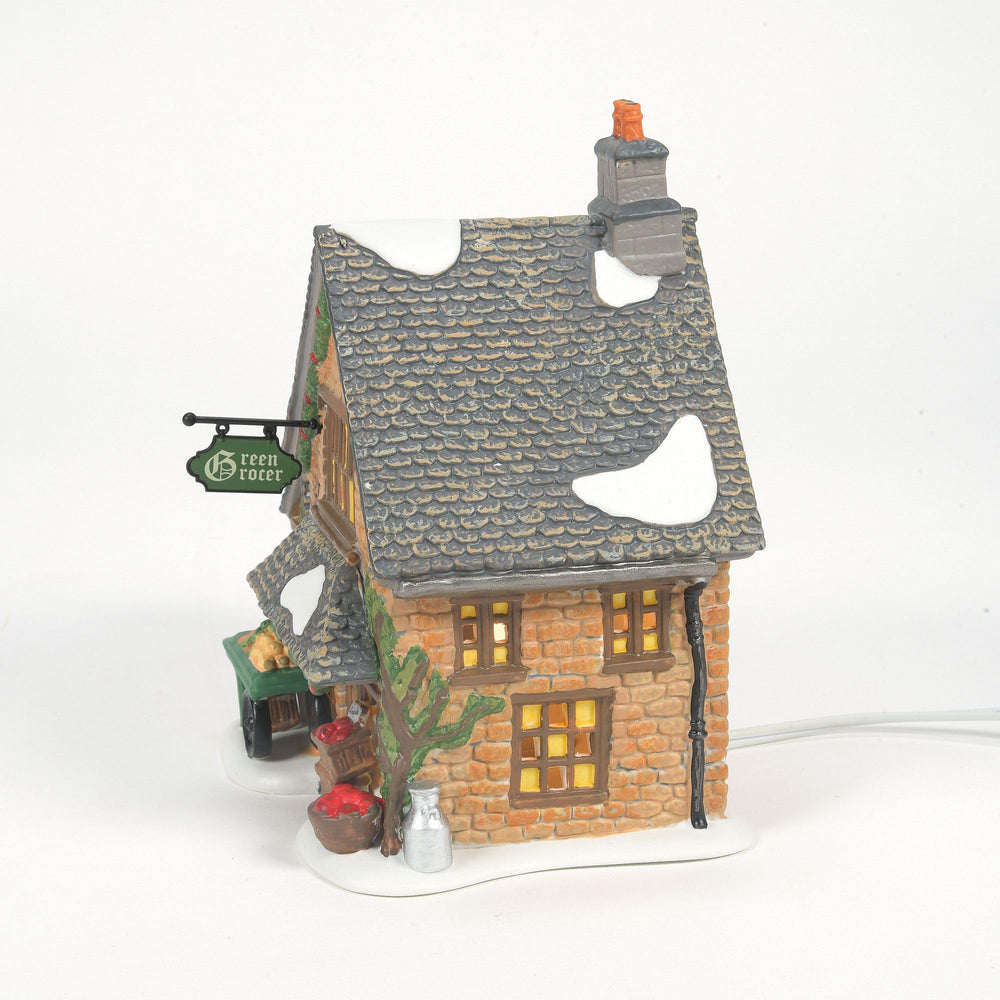 Department 56 bâtiment avec figurines illustrant intégration dans village