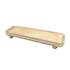 dwellington gros plan perles bois soulignant texture artisanale durable