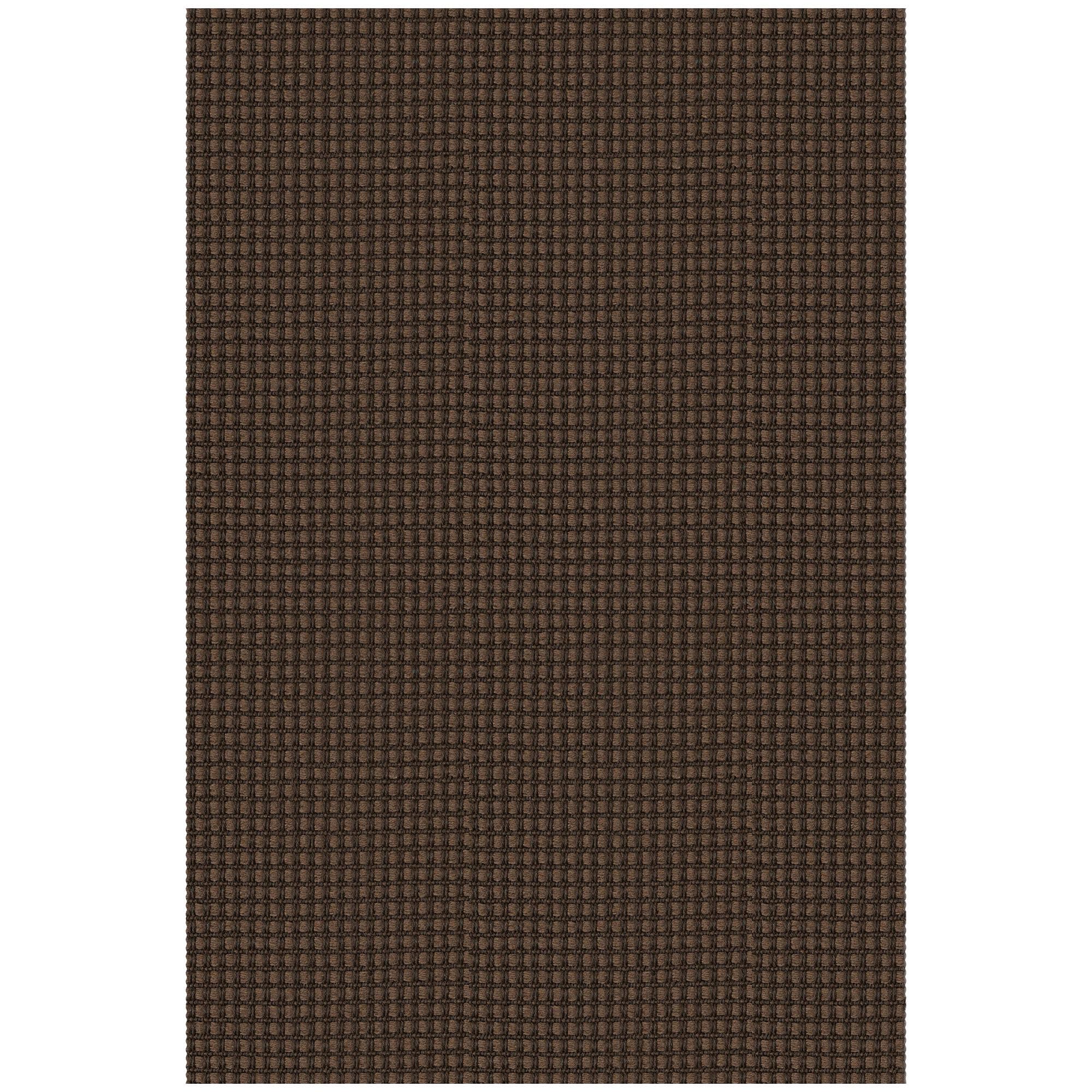 EARTHALL détail coupe manuelle montrant caractère artisanal du tapis