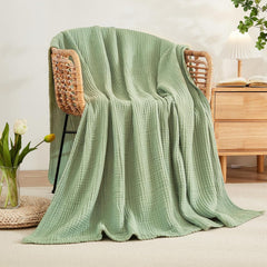 EMME couverture étalée sur un lit twin, offre une couverture généreuse et aérée
