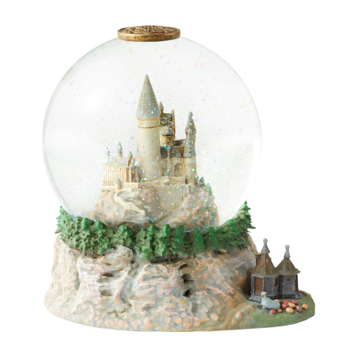 Enesco globe devant montrant le château de Poudlard et un rendu décoratif