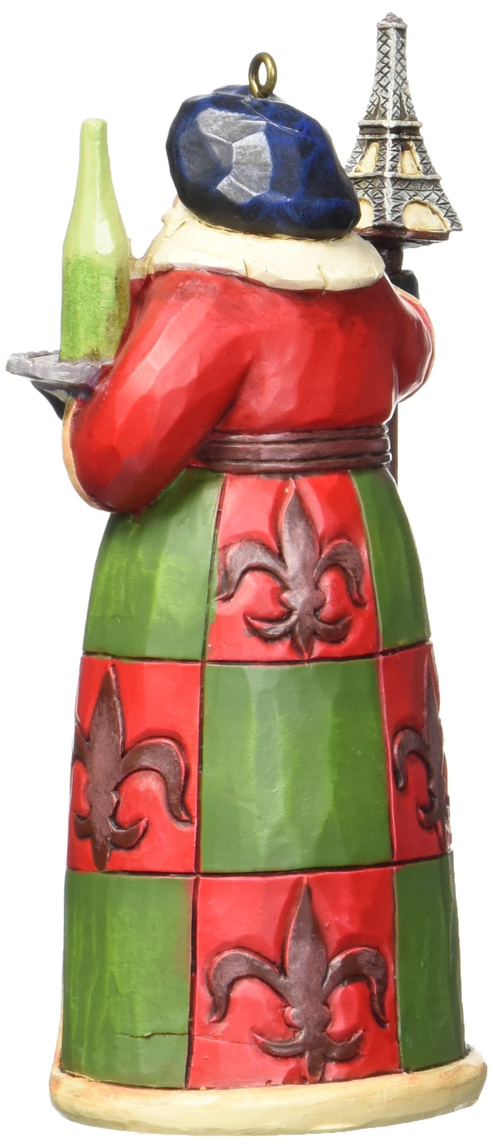 Enesco Jim Shore French Santa gros plan sur les motifs tour Eiffel et fleur-de-lis pour appréciation détail