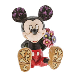Enesco Mini Mickey posé dans une main pour visualiser taille compacte et maniabilité